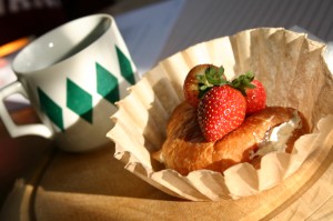 img_0848 A croissant with cream cheese and strawberries on top served up on an ubleached coffee filter.