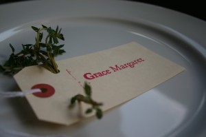 img_0891 Thyme is threaded through the holes of a place card to appeal to eye and nose.