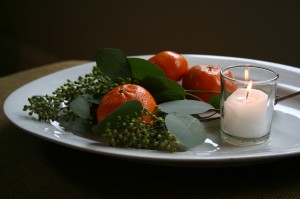 img_1482 Eucalyptus branches, tangerines and a votive candle on a simple ironstone platter make a simple yet stunning still life.