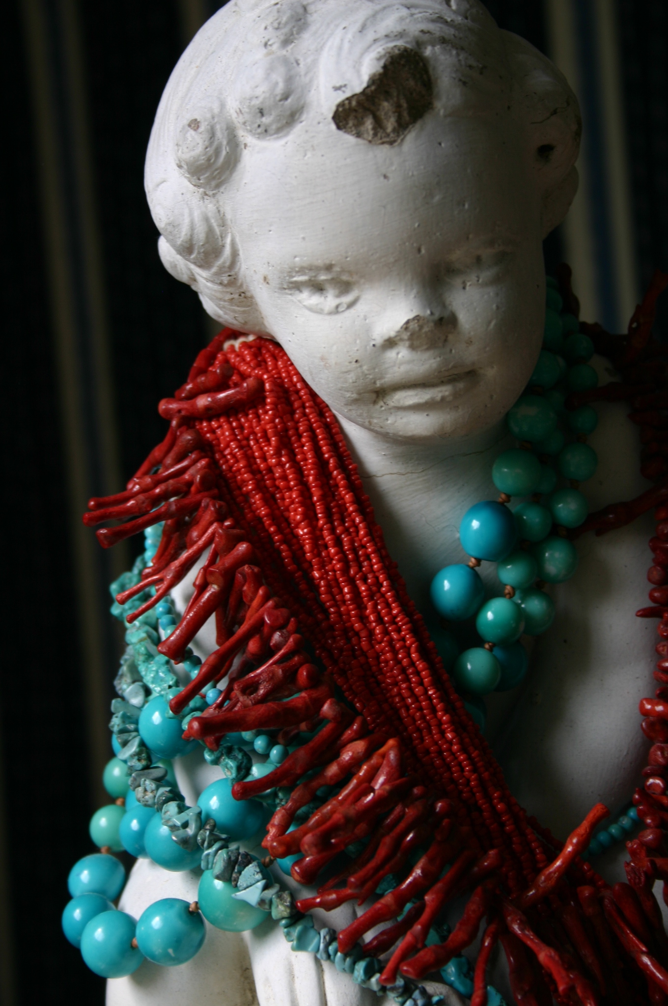 img_2110 My favorite necklaces draped around the neck of an old statue.