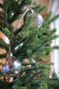 img_5582 Plain glass ornaments hang from knots on a strand of jute to create a delicate garland that looks like a string of glassy bubbles.
