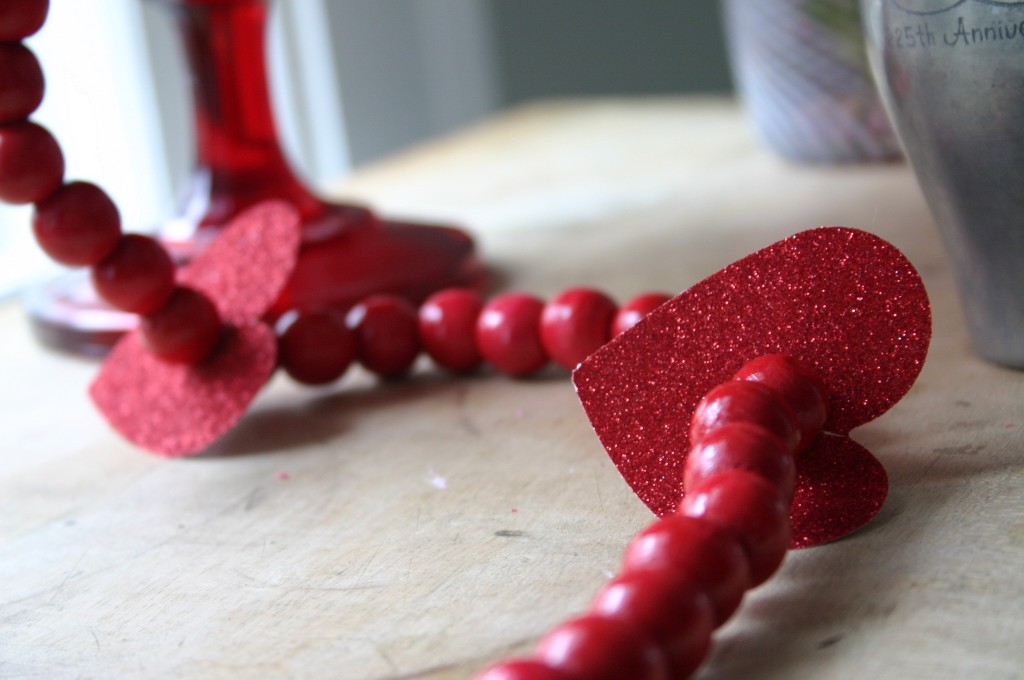 Making this type of cut, allows the hearts to slip on easily in between the beads.