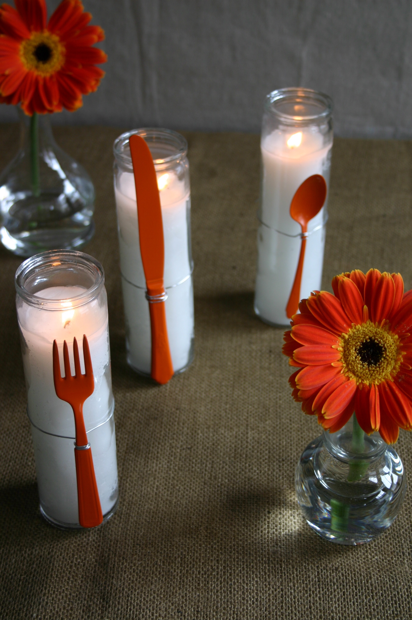 I was looking for something different for my table so, I spray painted some older utensils and wired them to white novena candles.