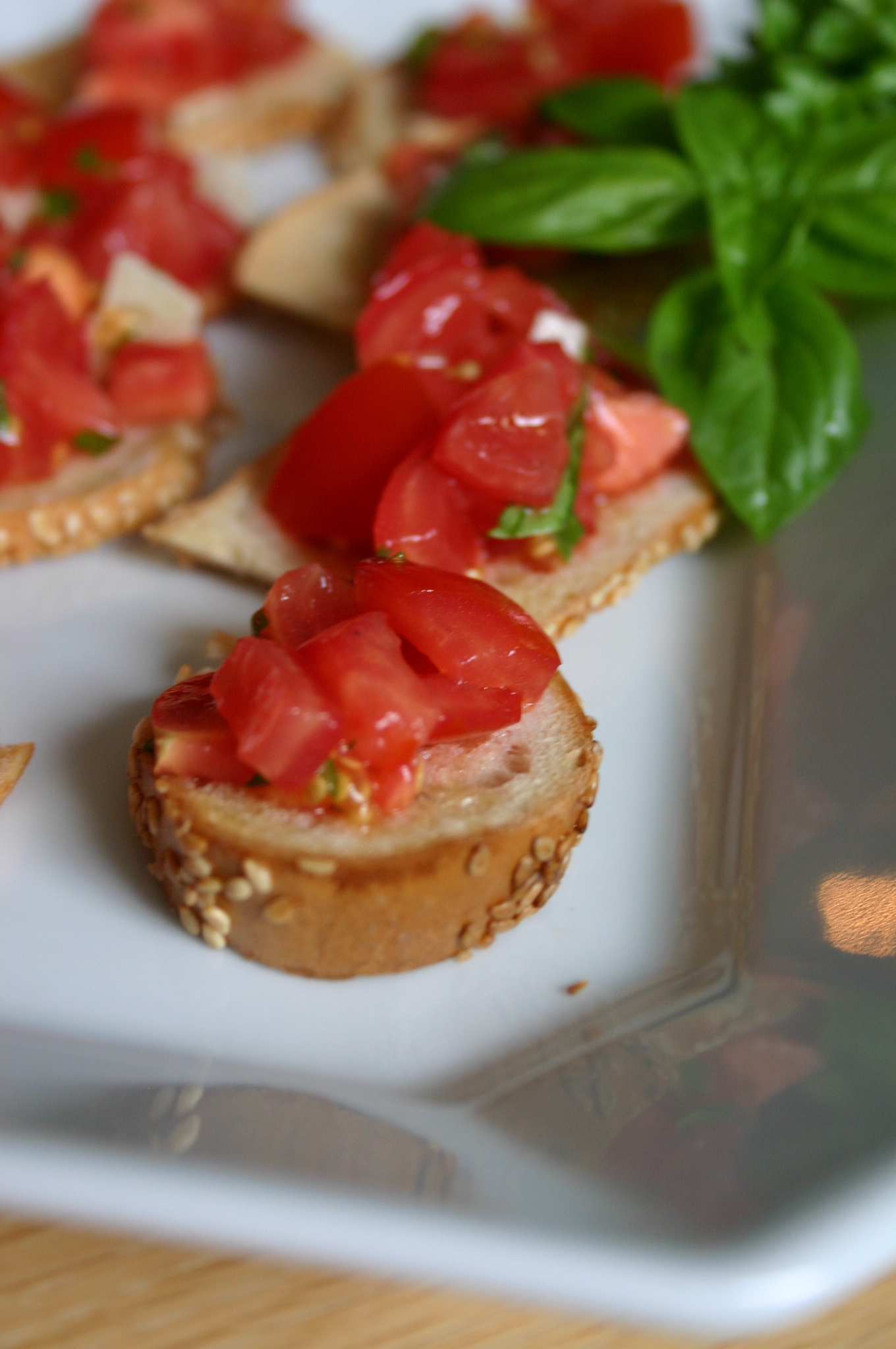IMG_2933 What to do with 2 left over bagels from Sunday morning breakfast? Try making this simple bagel bruschetta - you'll be surprised to see how many pieces you can get from 2 bagels.