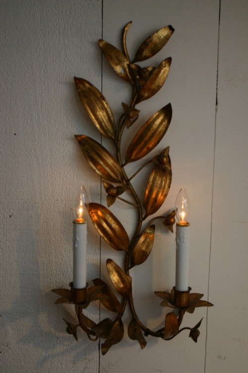 IMG_0976 Here's a great trick to create ambient lighting for an evening party - unscrew the candle from the base of an electric cordless candle and place in a wall sconce.