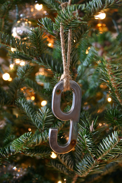 This year I had the good luck (in my mind) to come across a large bag of old house numbers at a thrift store. Priced at only $1.00 - I couldn't pass it up. Little did I know at the time, I would use them on my tree this year - but the idea came to me and I ran with it. I used jute to hang them.