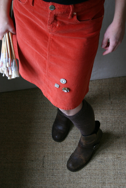3 rhinestone pins add holiday sparkle to a simple corduroy skirt.